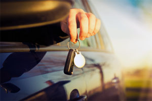 man holding keys in car after locksmith