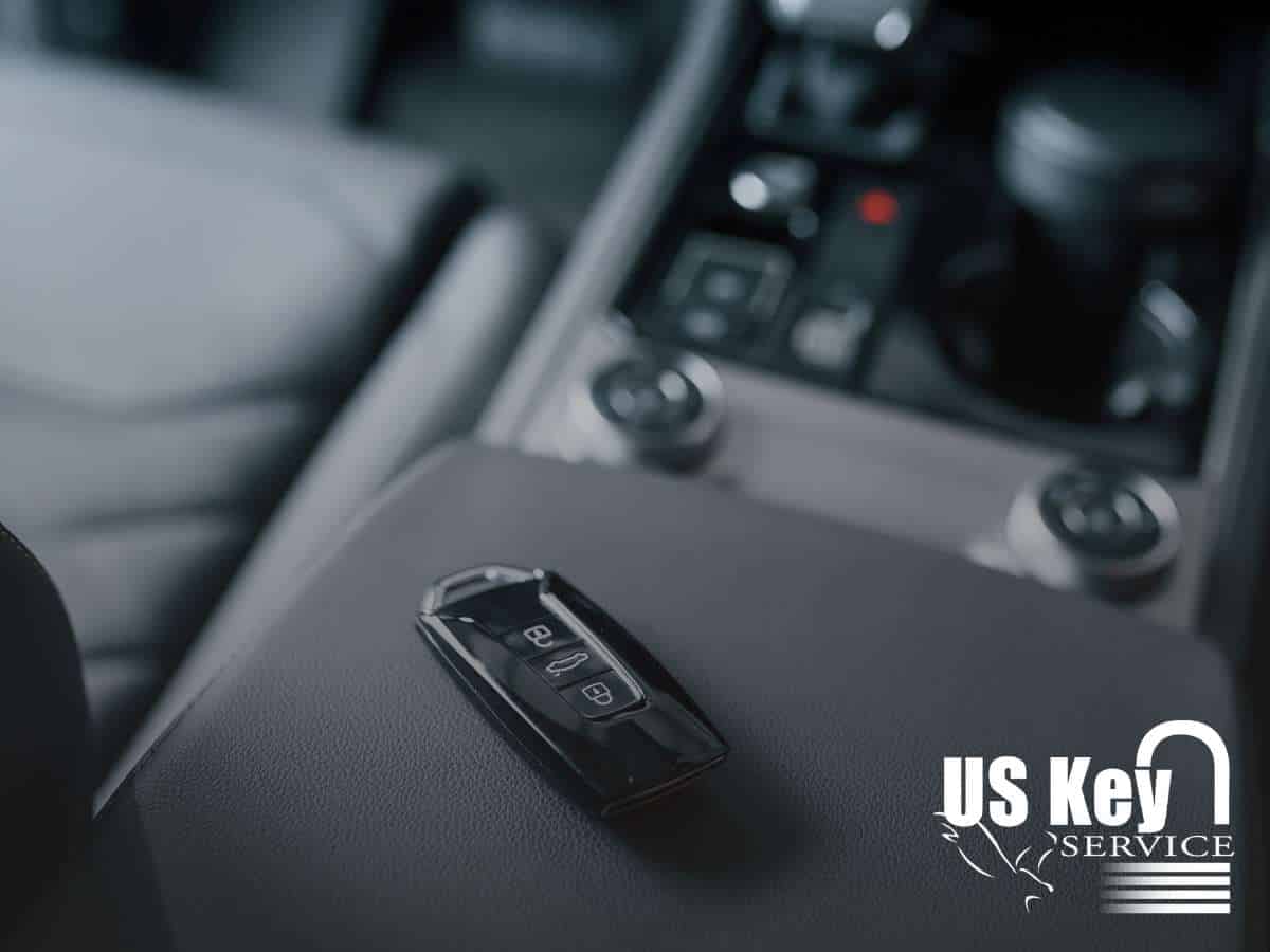 Black Key Fob resting on a car console near the gear shift inside a modern vehicle