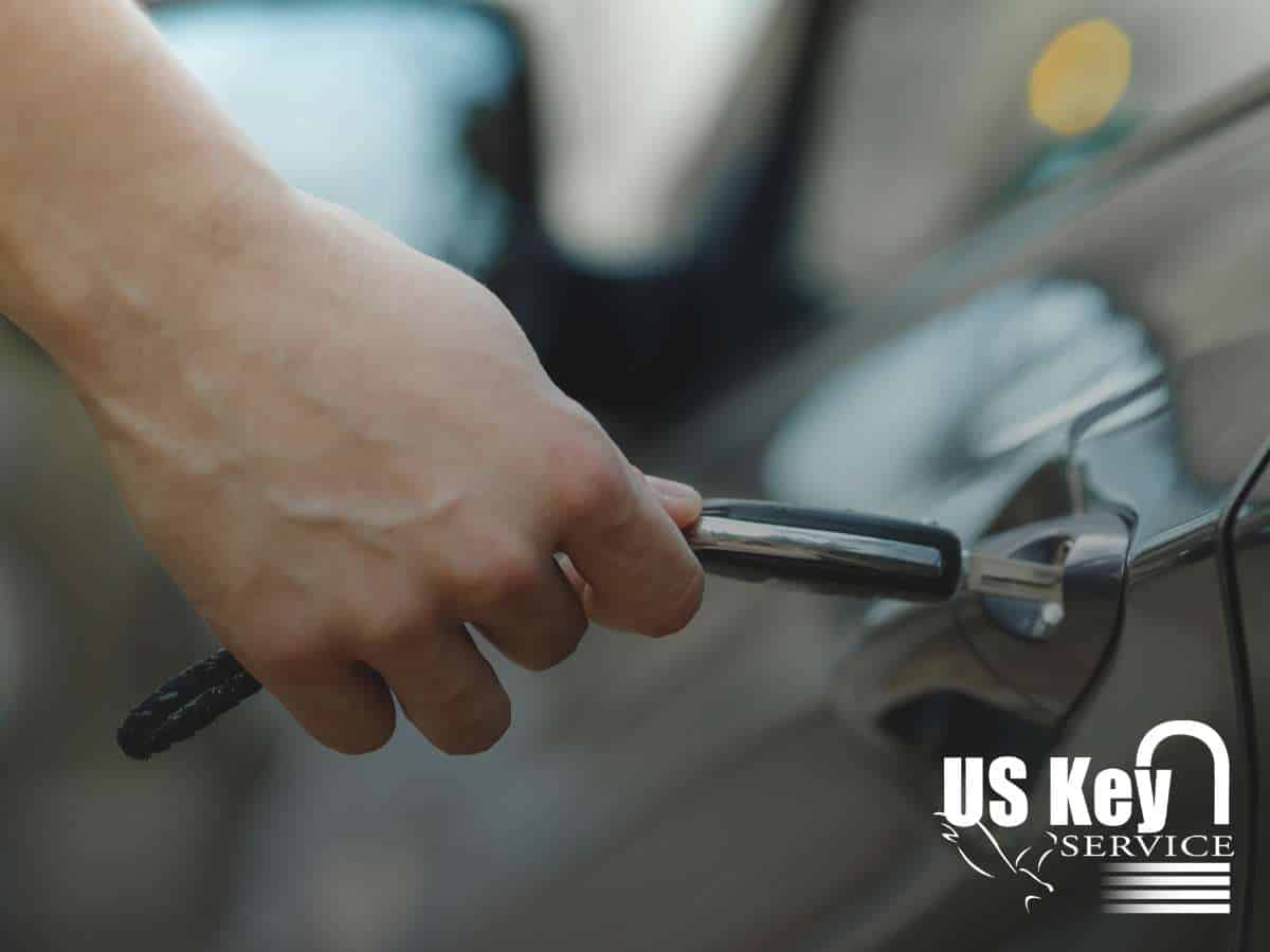 A man opening a car door with a key In Mesa, AZ